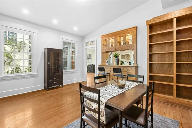 a view of a dining room with furniture window and wooden floor