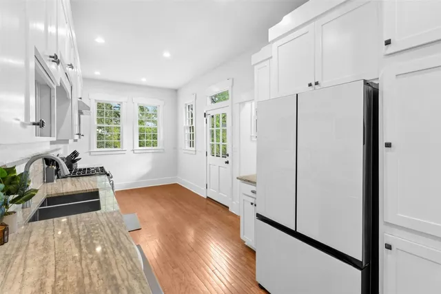 a kitchen with stainless steel appliances a refrigerator and a sink