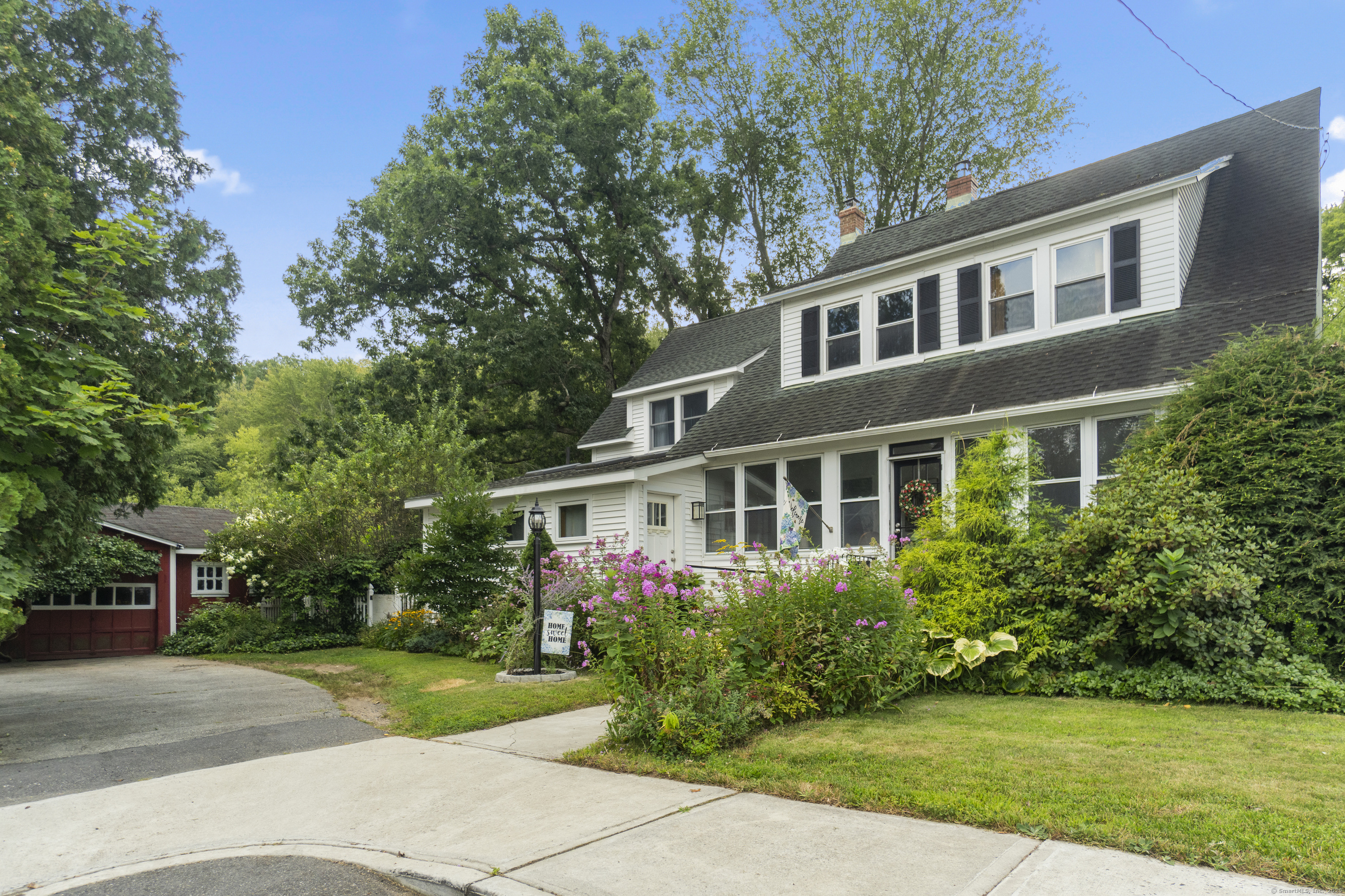 129 Grove Street Windham, CT 06226 - Photo 1 of 1 a front view of house with yard and green space
