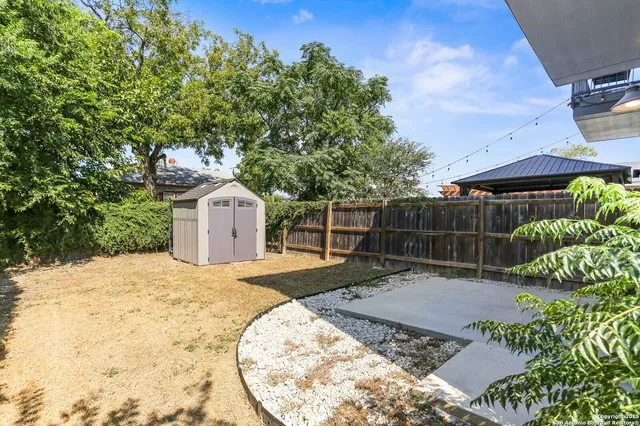 a backyard of a house with lots of green space