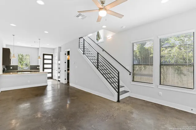 a view of an entryway with wooden floor
