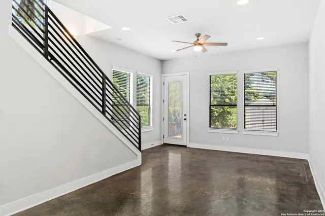 an entryway in a hall with a window