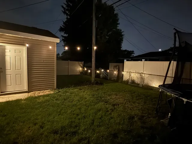 a view of backyard and entertaining space