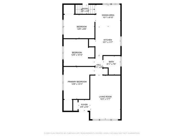 a picture of a bench in front of a wall