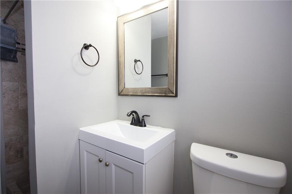 2974 McGlynn Court Decatur, GA 30034 - Photo 13 of 28 a bathroom with a toilet sink and mirror