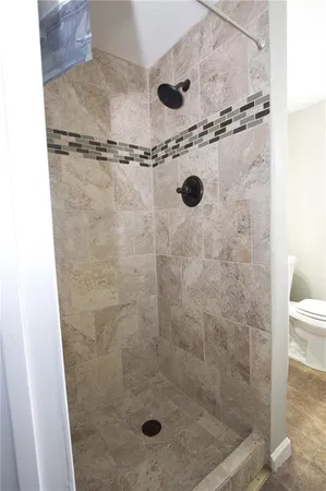 a bathroom with a toilet a sink and bathtub