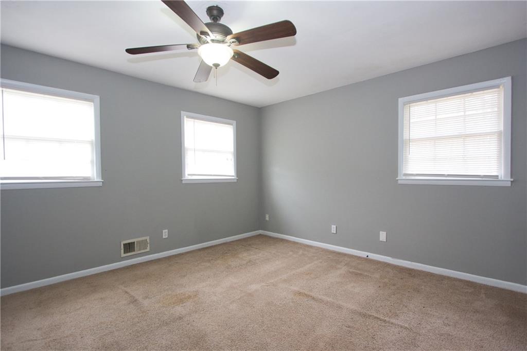 2974 McGlynn Court Decatur, GA 30034 - Photo 17 of 28 an empty room with a window and a fan