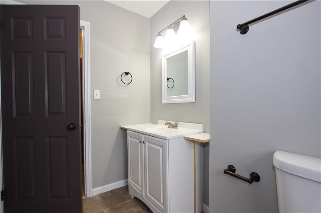 2974 McGlynn Court Decatur, GA 30034 - Photo 19 of 28 a bathroom with a sink a toilet and mirror