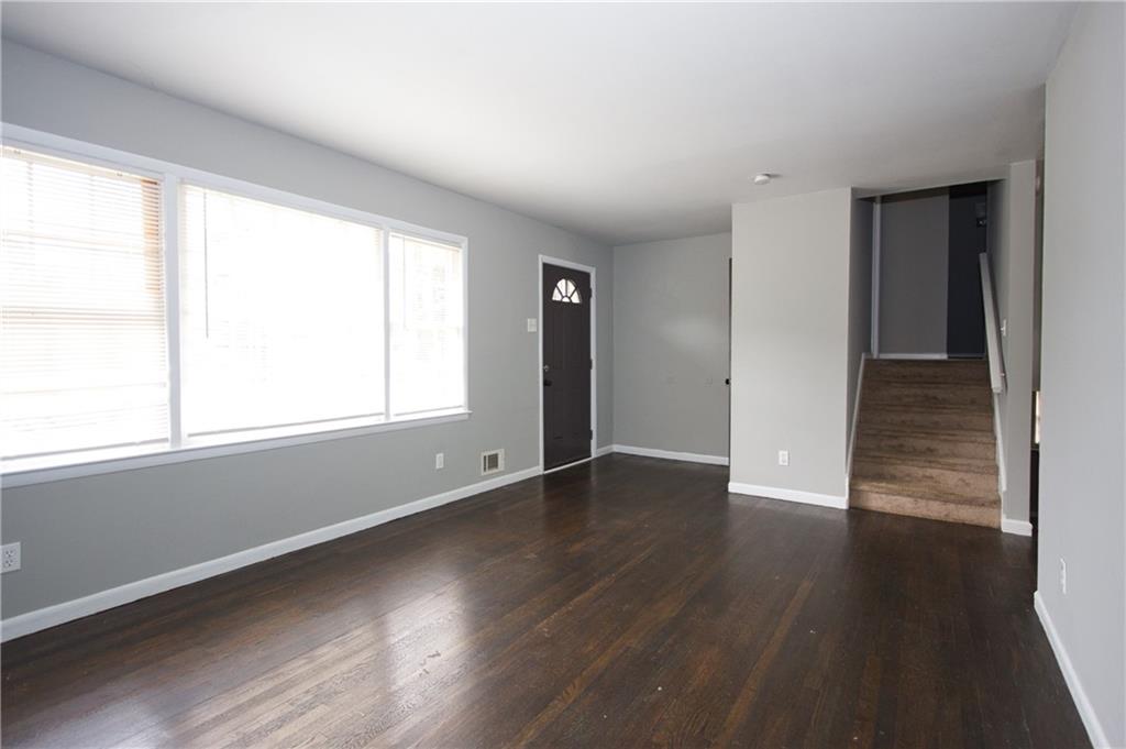 2974 McGlynn Court Decatur, GA 30034 - Photo 2 of 28 an empty room with wooden floor and windows