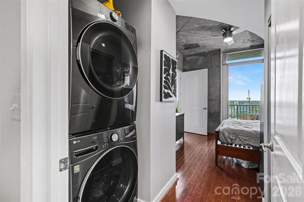 a view of a hallway with washer and dryer