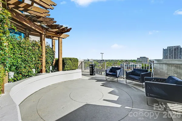 a view of a swimming pool with outdoor seating