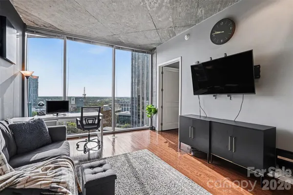 a living room with furniture and a flat screen tv