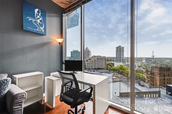 a view of a workspace with furniture