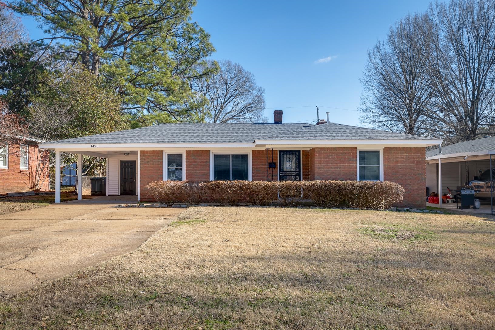 1490 Wilbec Road Memphis, TN 38117 - Photo 1 of 19 a front view of a house with a yard and trees