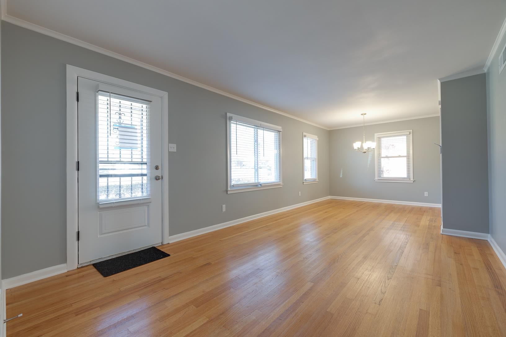 1490 Wilbec Road Memphis, TN 38117 - Photo 4 of 19 a view of empty room with wooden floor and fan
