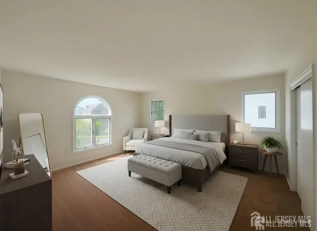 a bedroom with a bed a table and a window