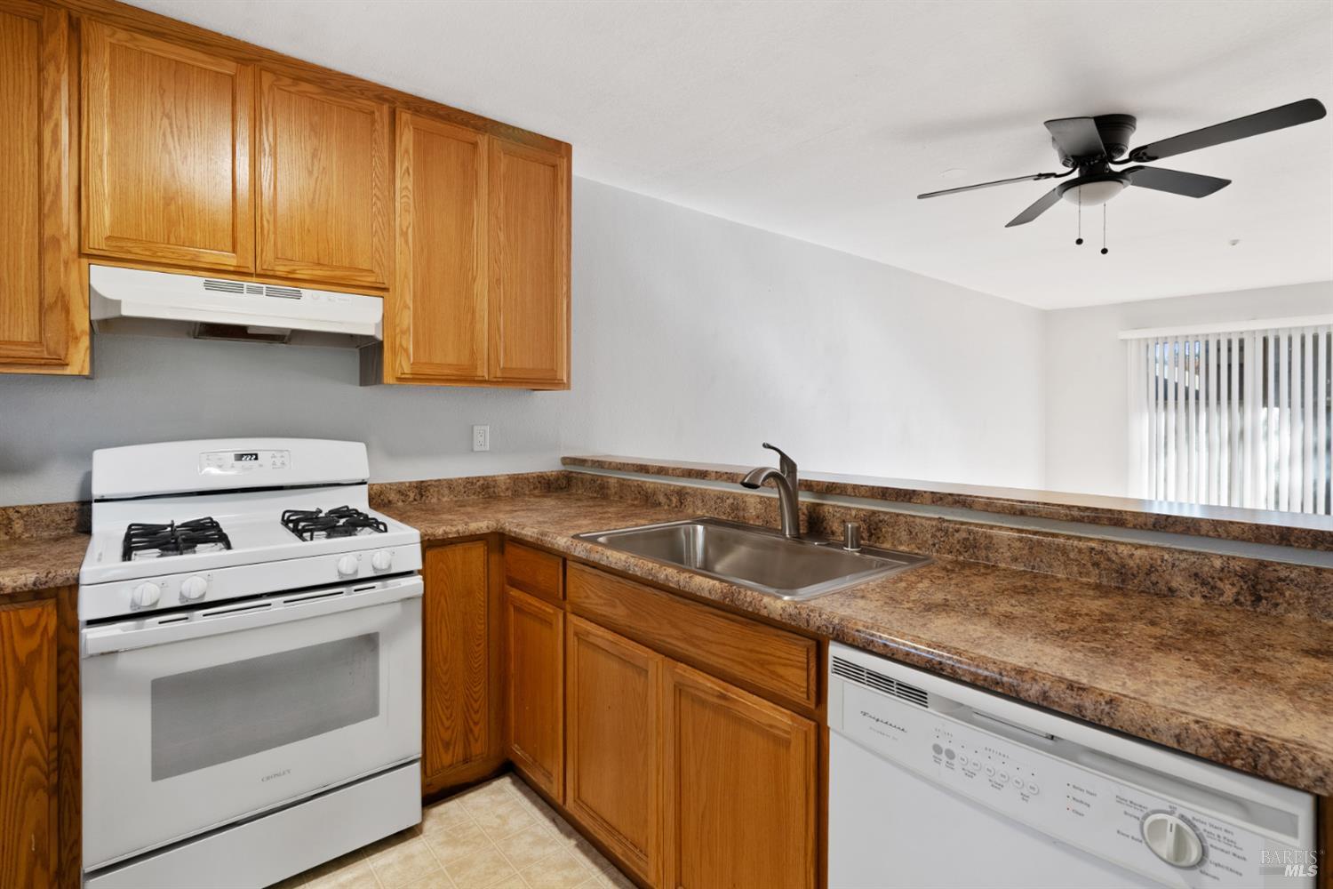 7651 Camino Colegio Rohnert Park, CA 94928 - Photo 6 of 15 a kitchen with a sink cabinets and appliances