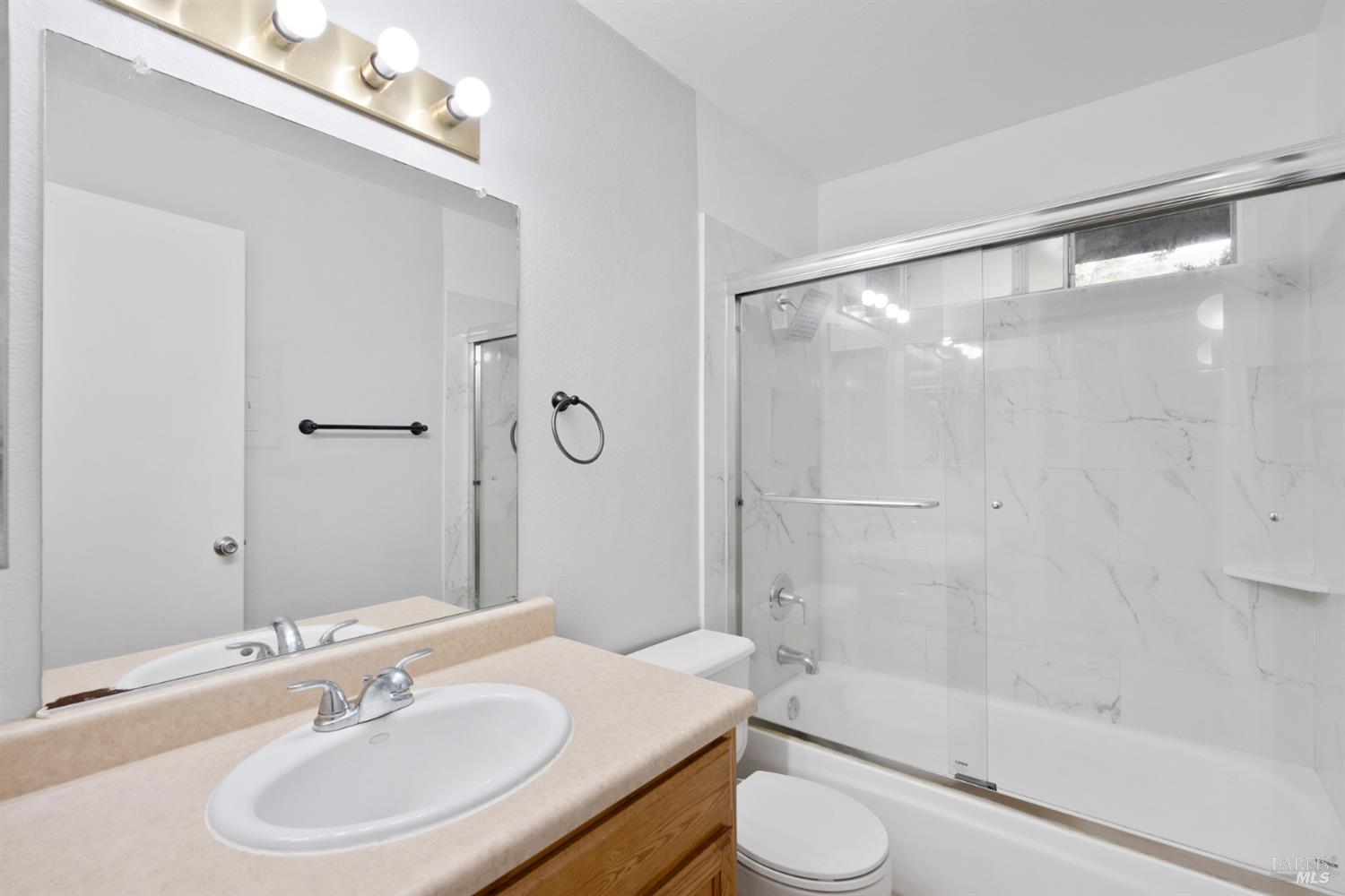 7651 Camino Colegio Rohnert Park, CA 94928 - Photo 8 of 15 a bathroom with a sink and a mirror