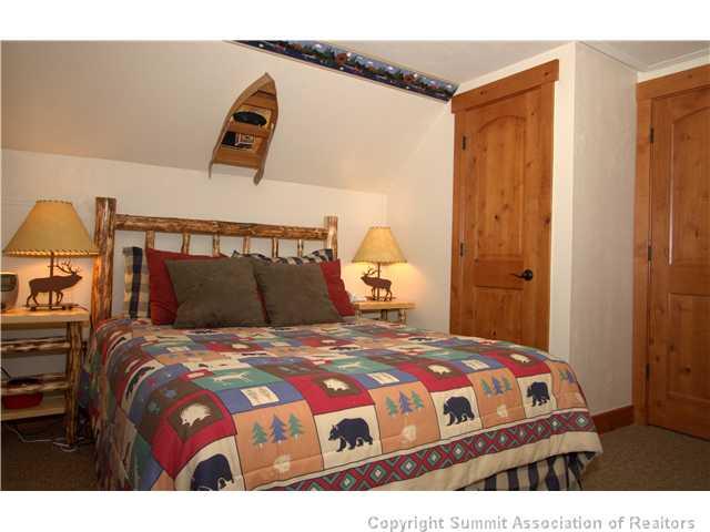 407 4 O'Clock Run Road Breckenridge, CO 80424 - Photo 11 of 25 a bedroom with a bed and a window