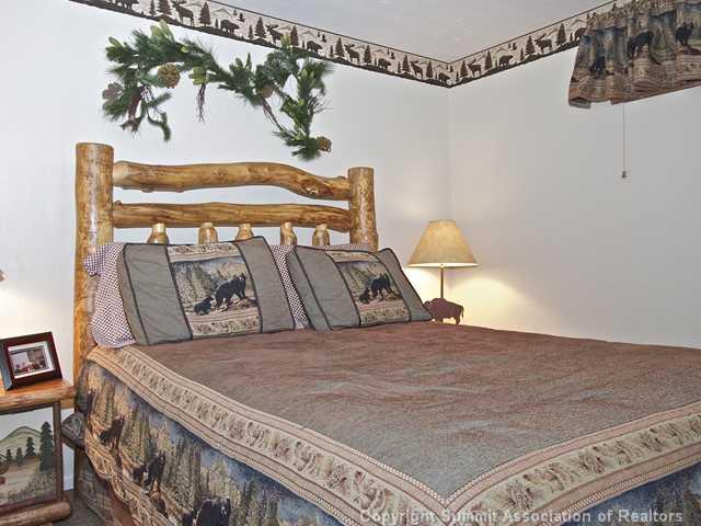 407 4 O'Clock Run Road Breckenridge, CO 80424 - Photo 13 of 25 a bedroom with a bed and window
