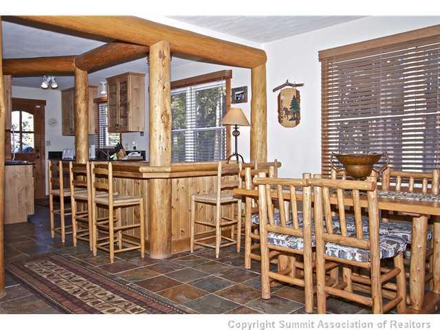 407 4 O'Clock Run Road Breckenridge, CO 80424 - Photo 19 of 25 a view of a dinning table and chairs in the room