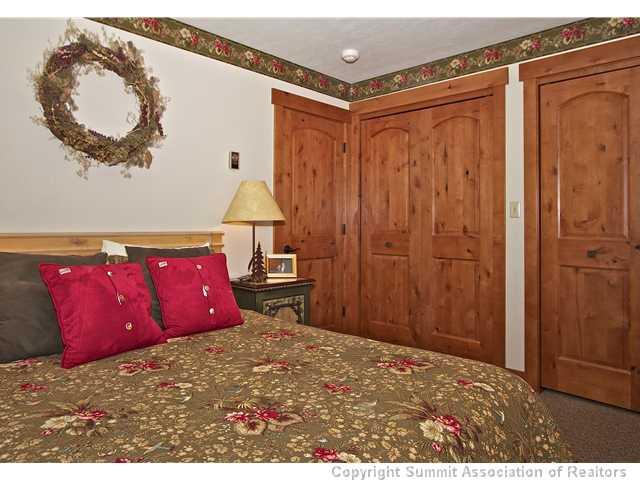 407 4 O'Clock Run Road Breckenridge, CO 80424 - Photo 7 of 25 a bedroom with a bed and a mirror