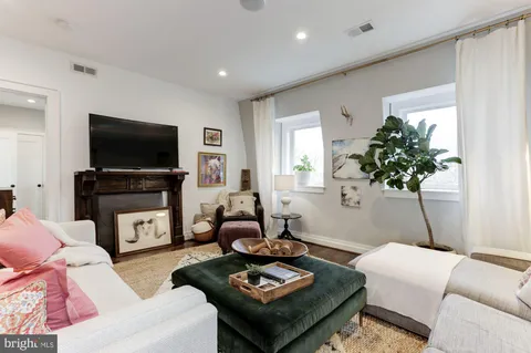 a living room with furniture and a table