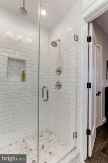 a bedroom with a bed and a desk