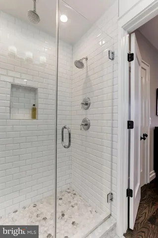 a bedroom with a bed and a desk