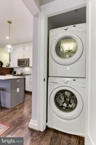 a roof deck with couch and chairs