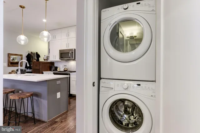 a roof deck with a table and chairs