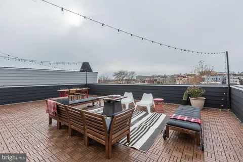 a view of a terrace with seating area