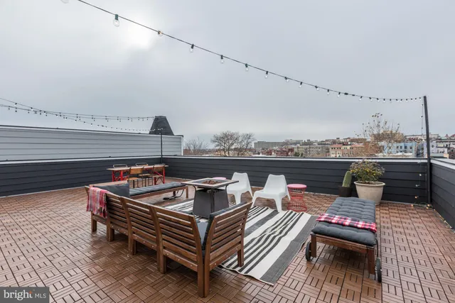 a view of a terrace with seating area