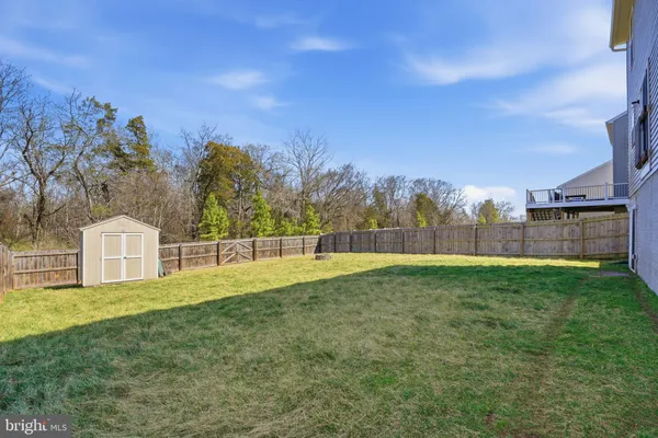 a view of backyard with green space
