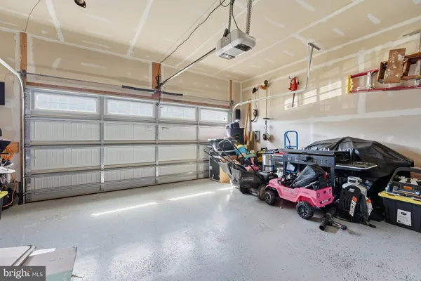 a storage room with furniture and a garage