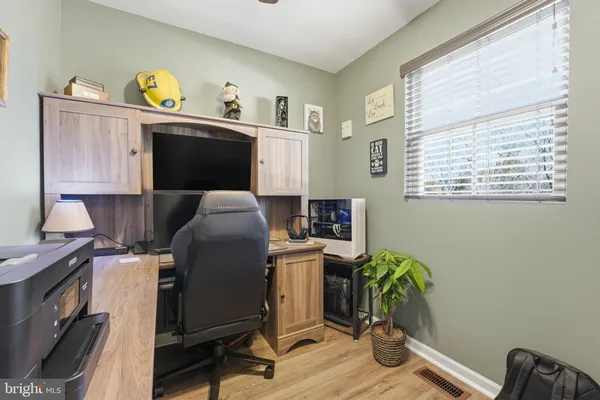 a workspace with furniture and a window