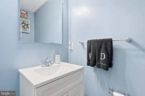 a bathroom with a sink and a washing machine