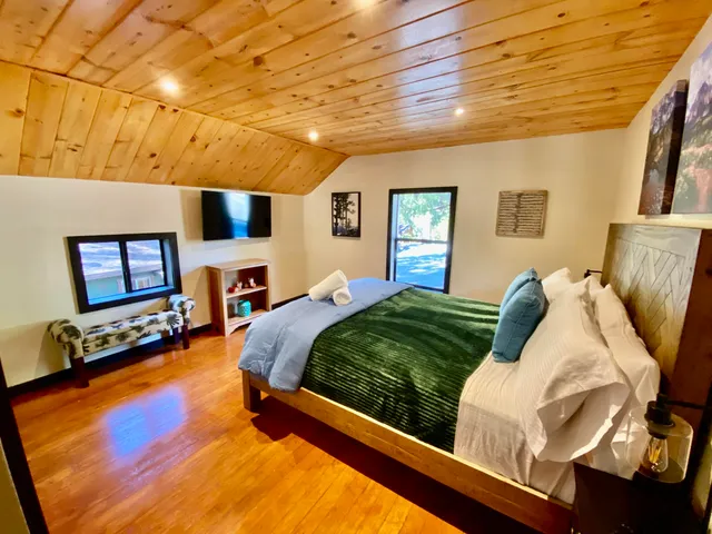 a bedroom with furniture and a fireplace