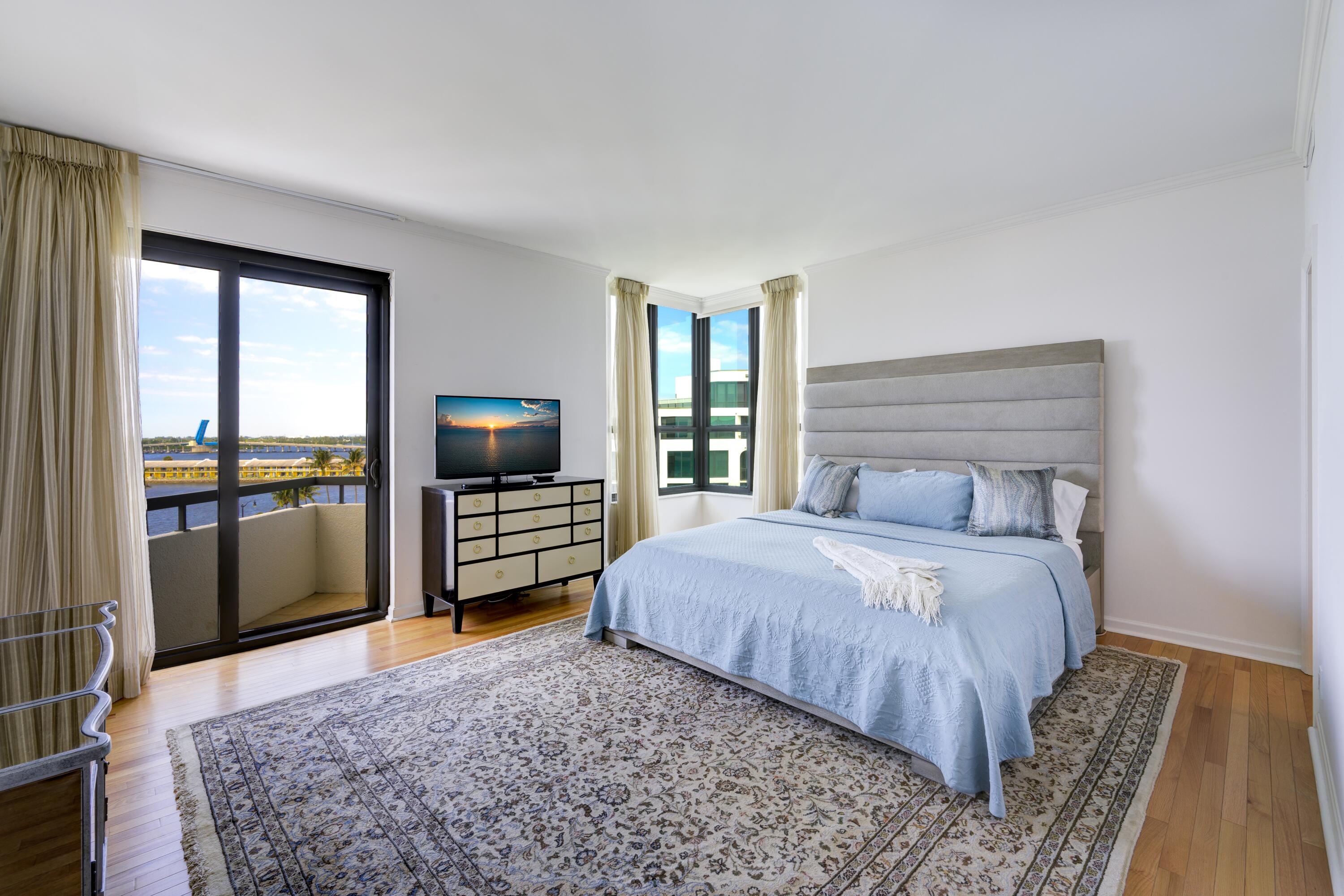 3120 South Ocean Boulevard, Unit 3602 Palm Beach, FL 33480 - Photo 11 of 22 a bedroom with a bed and a television in it