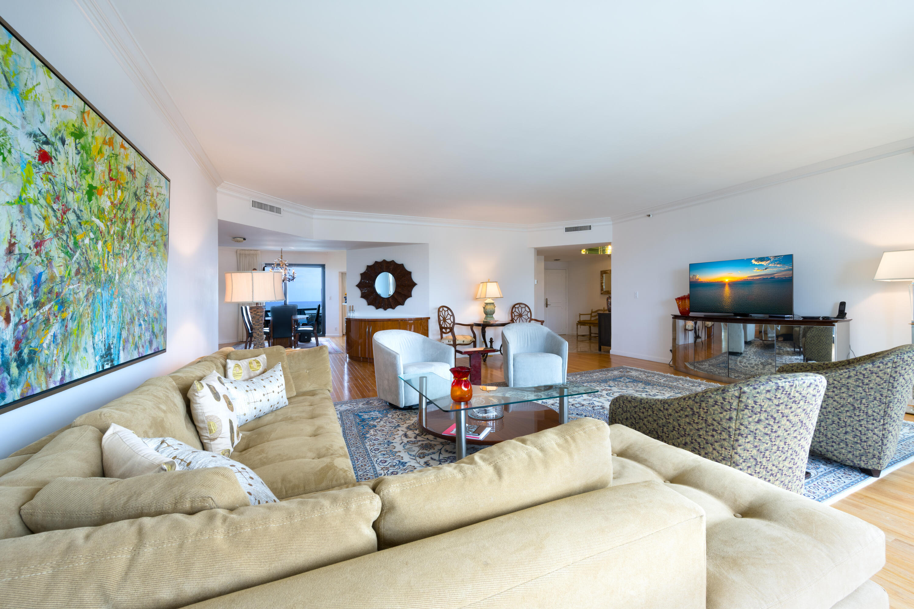 3120 South Ocean Boulevard, Unit 3602 Palm Beach, FL 33480 - Photo 4 of 22 a living room with furniture and a flat screen tv