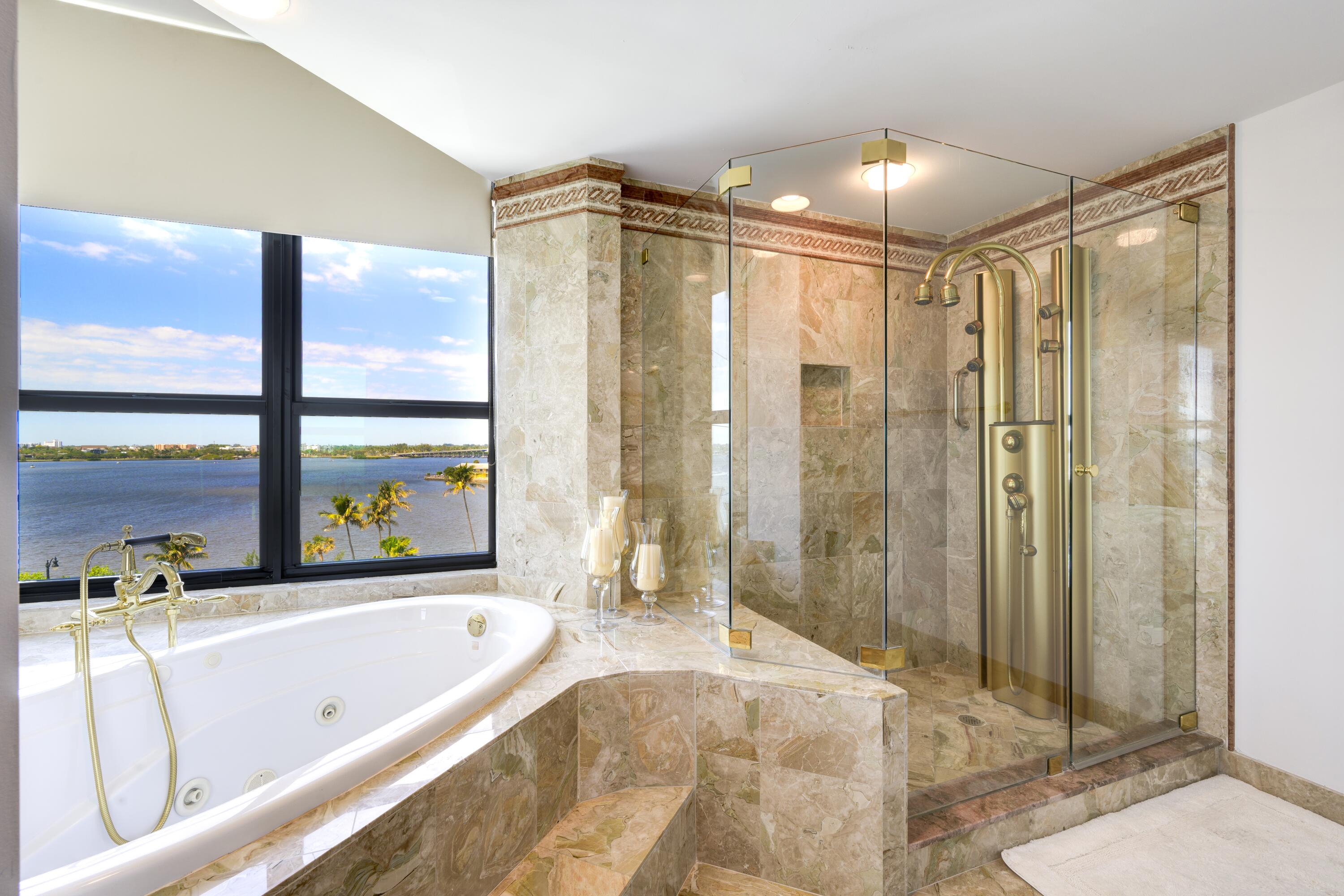 3120 South Ocean Boulevard, Unit 3602 Palm Beach, FL 33480 - Photo 9 of 22 a bathroom with a large tub a shower and view