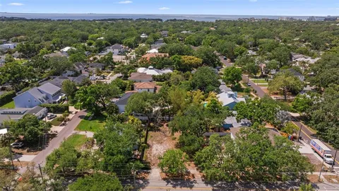 an aerial view of a town with trees
