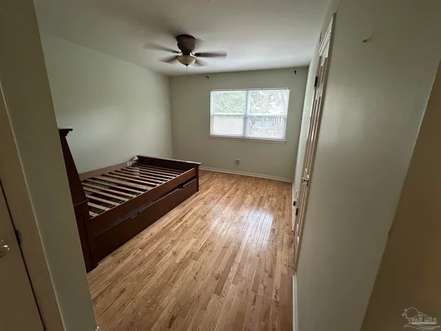 a view of a balcony with wooden floor and staircase