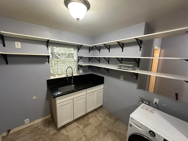 a bathroom with a toilet and a mirror