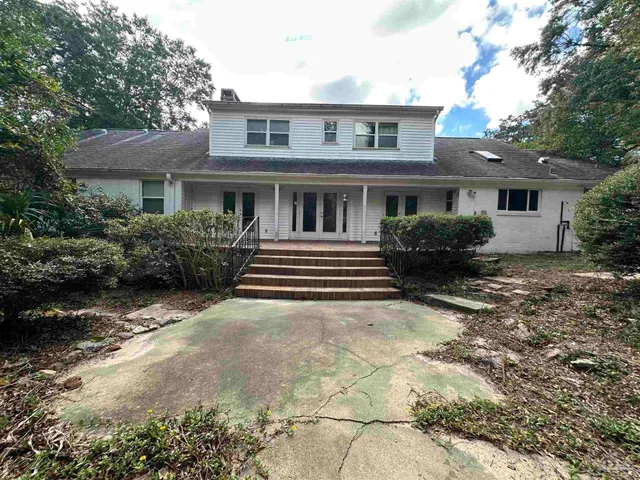 a house view with a garden space