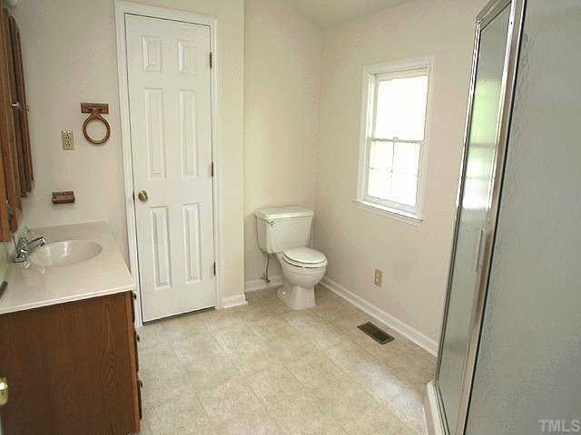 158 Lin Tilley Road Durham, NC 27712 - Photo 7 of 12 a bathroom with a sink toilet and shower