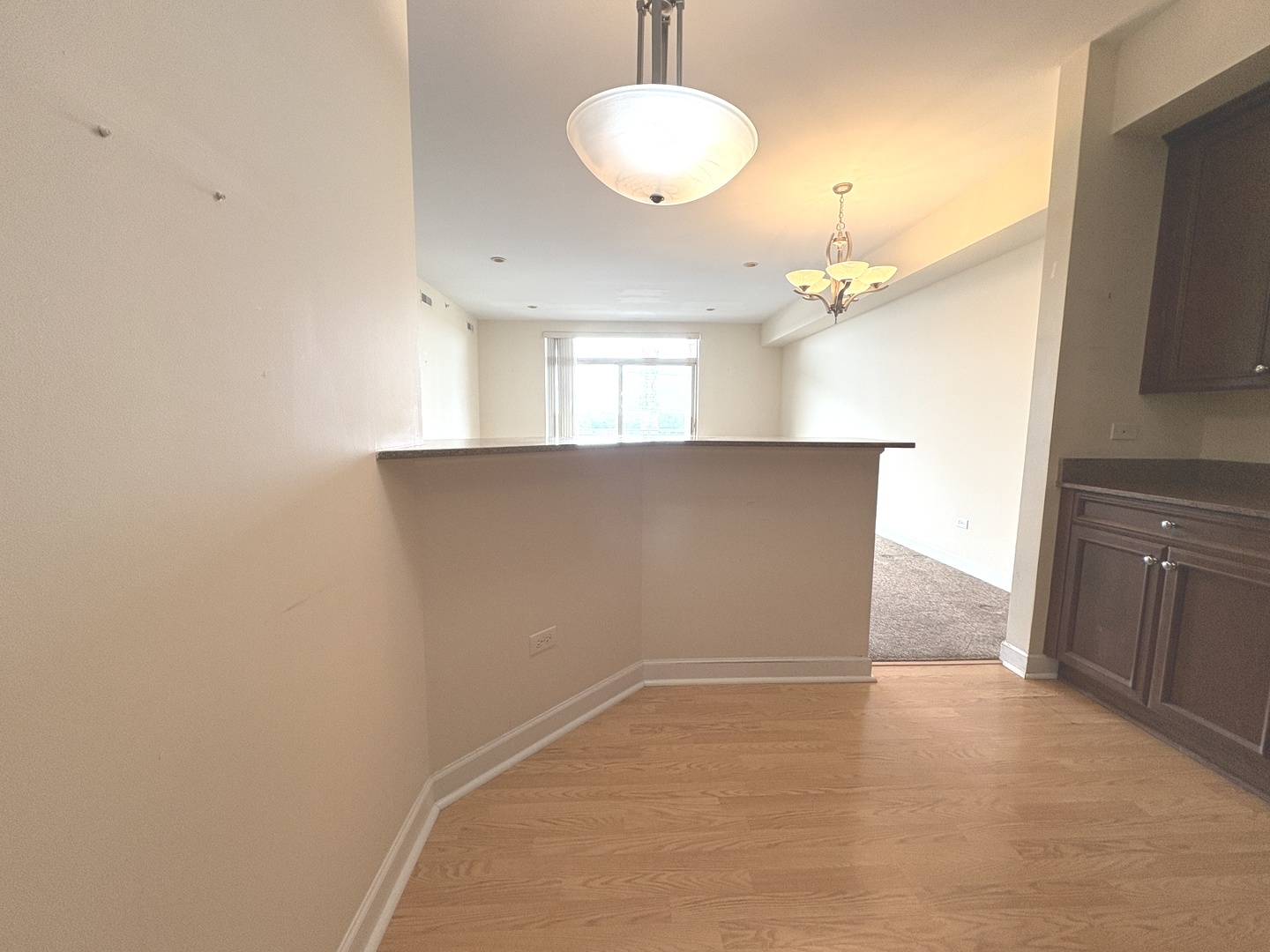 8300 Callie Avenue, Unit 610 Morton Grove, IL 60053 - Photo 11 of 32 wooden floor in an empty room