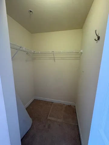 a view of storage and utility room with racks on the wall