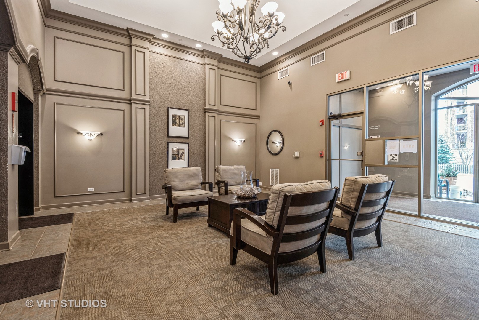 8300 Callie Avenue, Unit 610 Morton Grove, IL 60053 - Photo 3 of 32 a living room with furniture and a chandelier