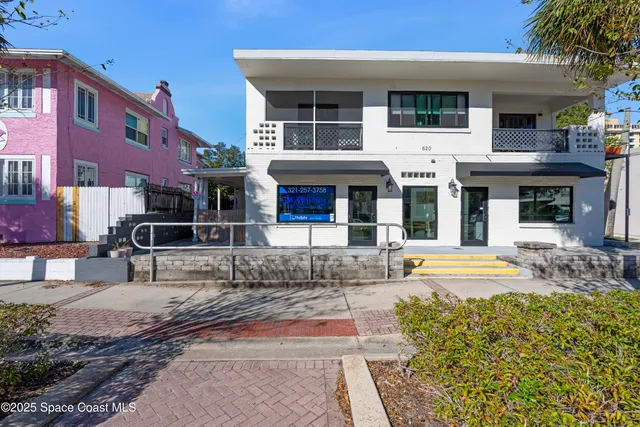 a view of a building with sitting area